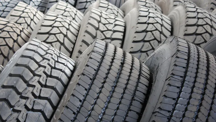 Rows of new black tyres
