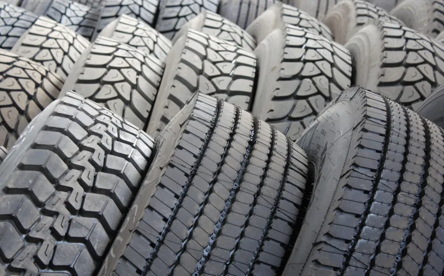 Rows of new black tyres